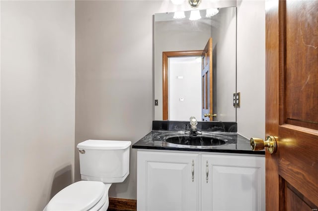 bathroom with toilet and vanity