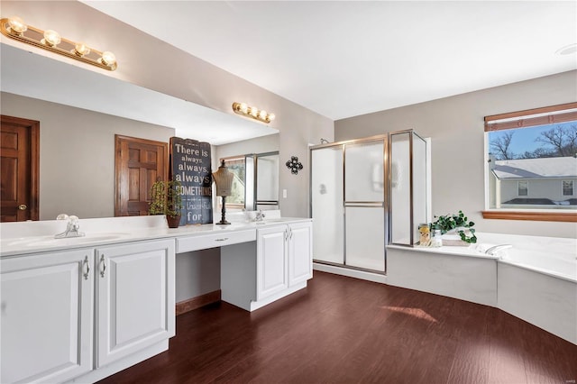 bathroom with shower with separate bathtub, vanity, and hardwood / wood-style flooring