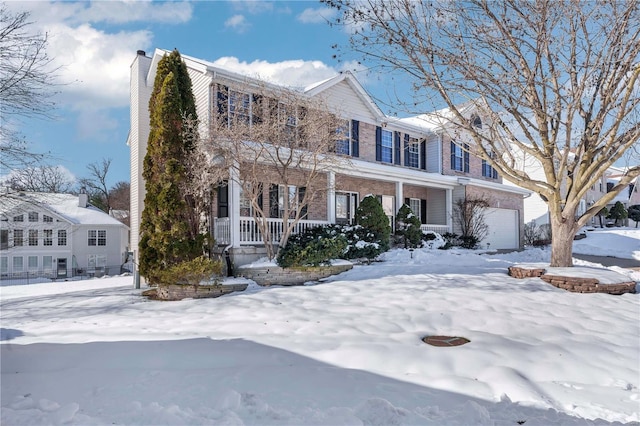 view of front of property with a garage and a porch