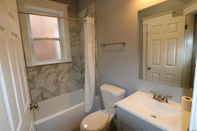 full bathroom featuring shower / bath combination with curtain, vanity, and toilet