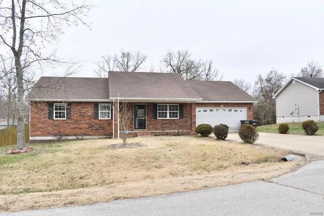 single story home featuring a front yard and a garage