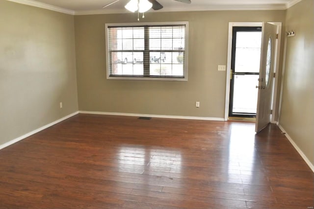 spare room featuring ceiling fan, dark hardwood / wood-style floors, and ornamental molding