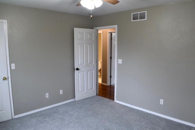 unfurnished bedroom with carpet and ceiling fan