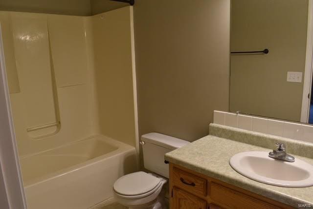 full bathroom featuring vanity, toilet, and shower / washtub combination