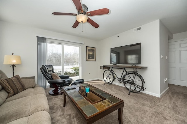 living room featuring ceiling fan and carpet floors