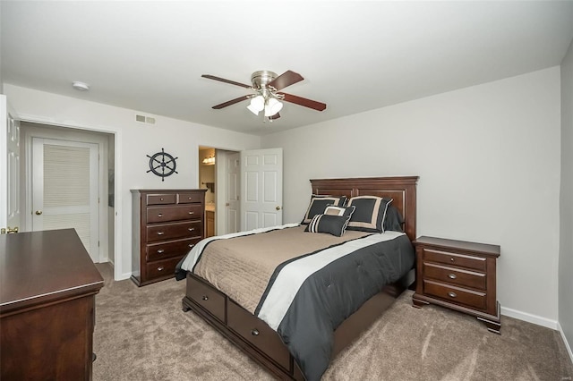 bedroom featuring ceiling fan and light carpet