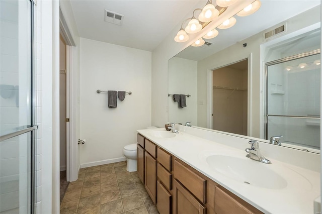 bathroom featuring vanity, an inviting chandelier, toilet, and walk in shower