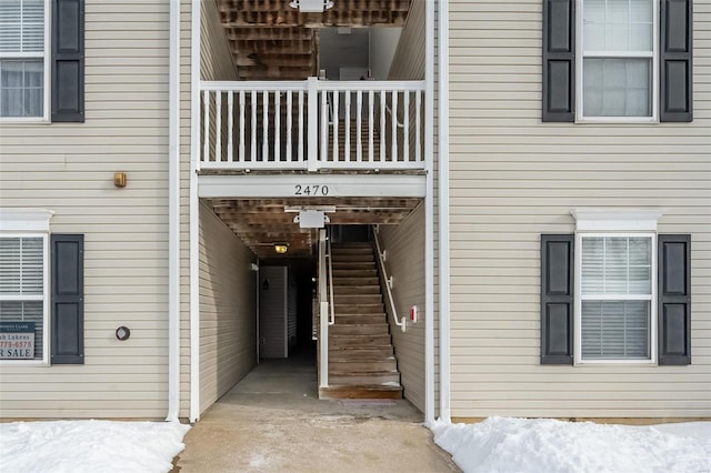 view of snow covered property entrance