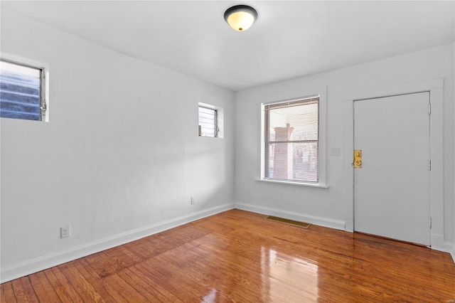 entryway with hardwood / wood-style flooring