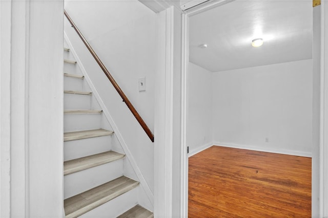 stairway with wood-type flooring