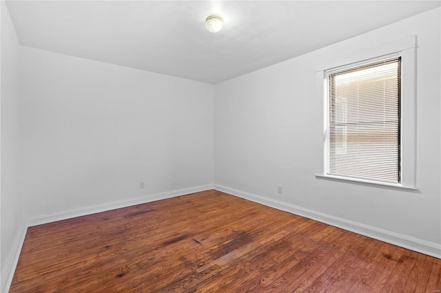 empty room featuring hardwood / wood-style flooring