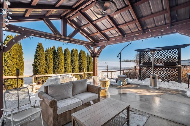 view of patio featuring a gazebo, an outdoor hangout area, and a water view