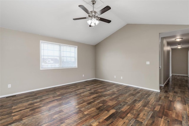 empty room with ceiling fan, dark wood-type flooring, and vaulted ceiling