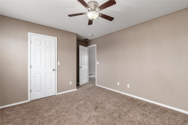 unfurnished bedroom featuring ceiling fan and carpet