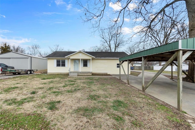 single story home featuring a carport