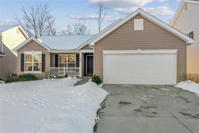 ranch-style home with a garage and covered porch