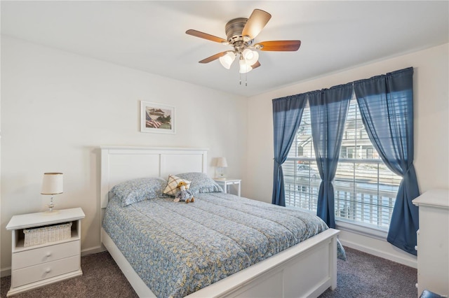 bedroom featuring dark colored carpet and ceiling fan