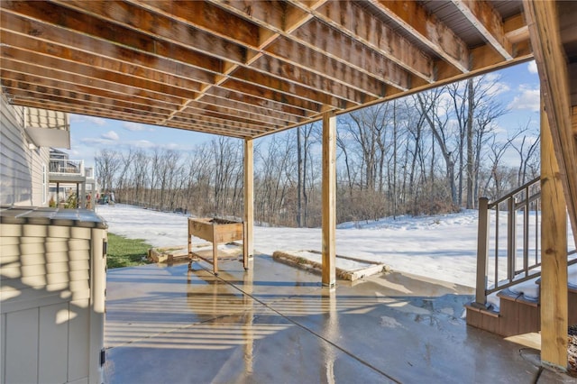 view of snow covered patio