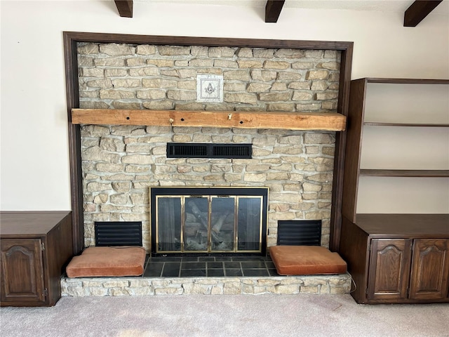 room details featuring a fireplace and carpet floors