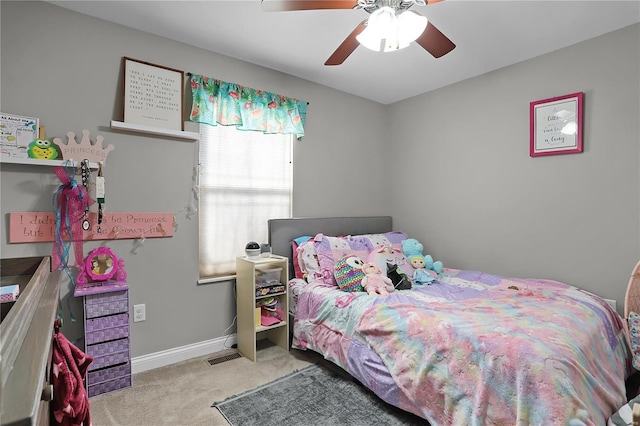 bedroom featuring light colored carpet and ceiling fan