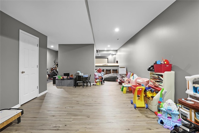 playroom featuring light wood-type flooring