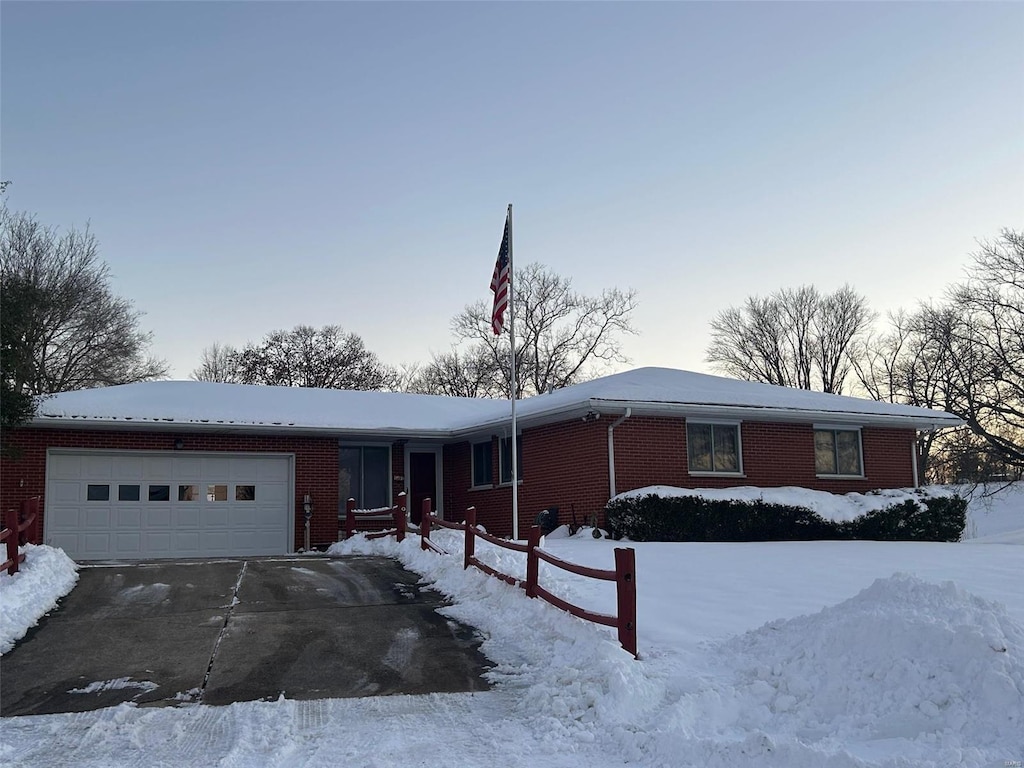 single story home featuring a garage