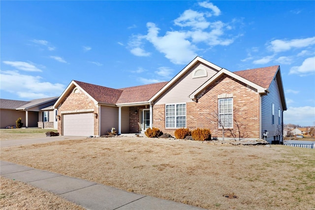 view of front of property with a garage and a front yard