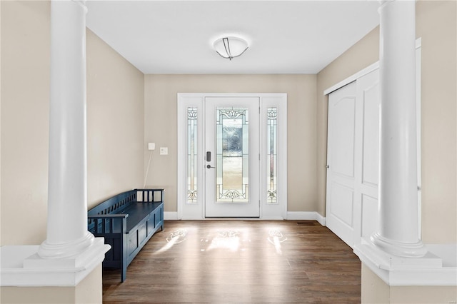 entrance foyer featuring decorative columns and wood-type flooring