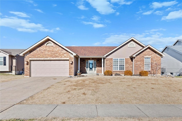 ranch-style home with central AC and a garage