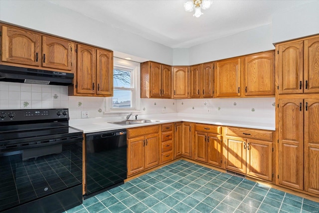 kitchen featuring tasteful backsplash, sink, and black appliances