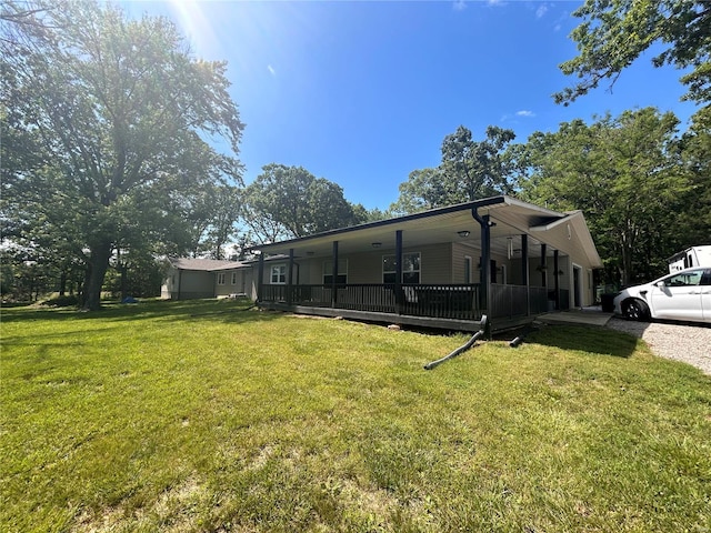 view of side of home featuring a lawn