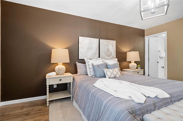 bedroom with wood-type flooring