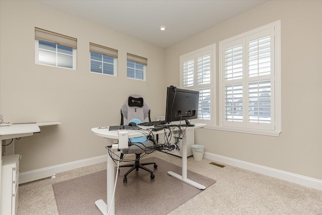 office space featuring light carpet