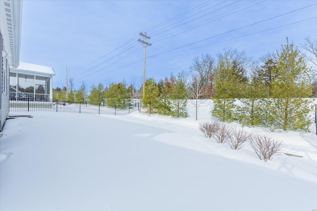 view of yard layered in snow