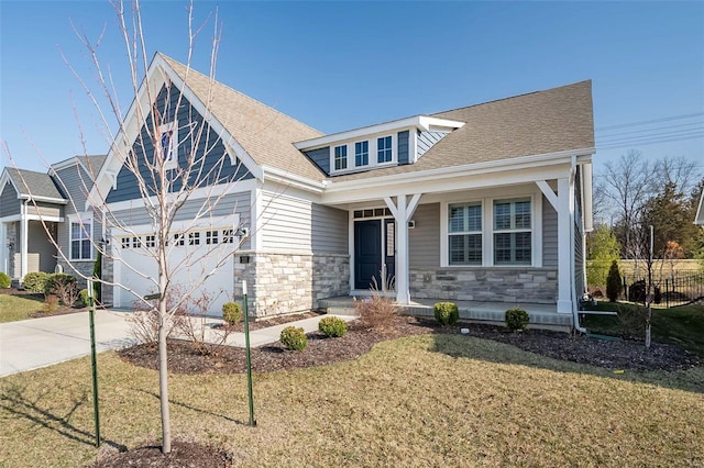 view of front of house featuring a garage, stone siding, concrete driveway, and a shingled roof