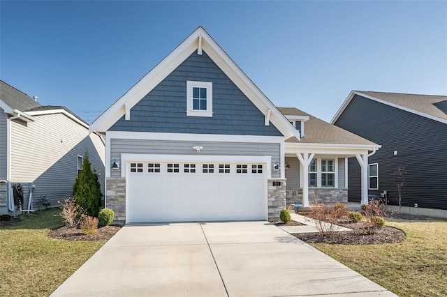 craftsman-style house with a shingled roof, concrete driveway, a front yard, a garage, and stone siding