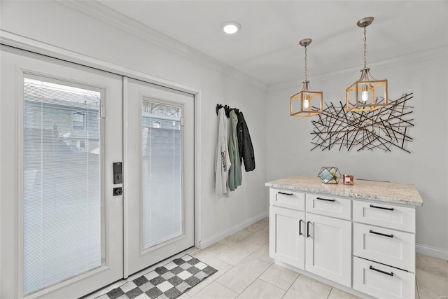 doorway to outside with ornamental molding and light tile patterned floors