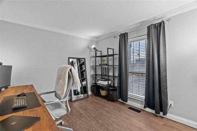 office space featuring wood-type flooring and ornamental molding