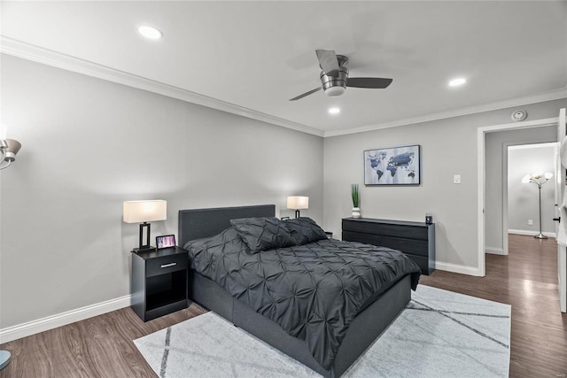 bedroom featuring ceiling fan, crown molding, and dark wood-type flooring