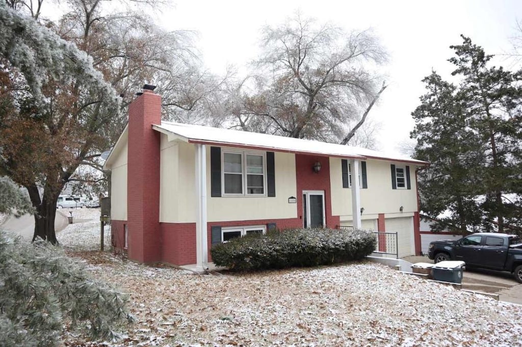 split foyer home featuring a garage