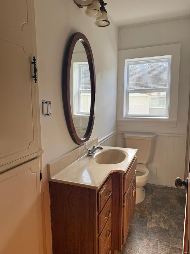 bathroom featuring vanity and toilet