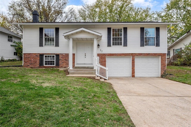 raised ranch featuring a front yard and a garage