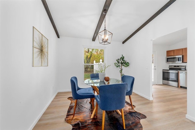 dining room featuring lofted ceiling with beams, a notable chandelier, and light hardwood / wood-style floors