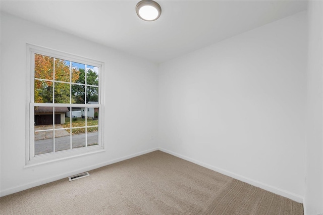 unfurnished room with carpet floors