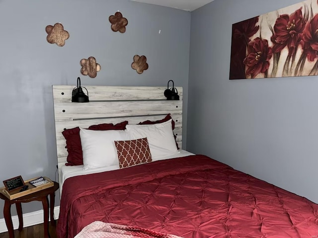 bedroom with hardwood / wood-style floors