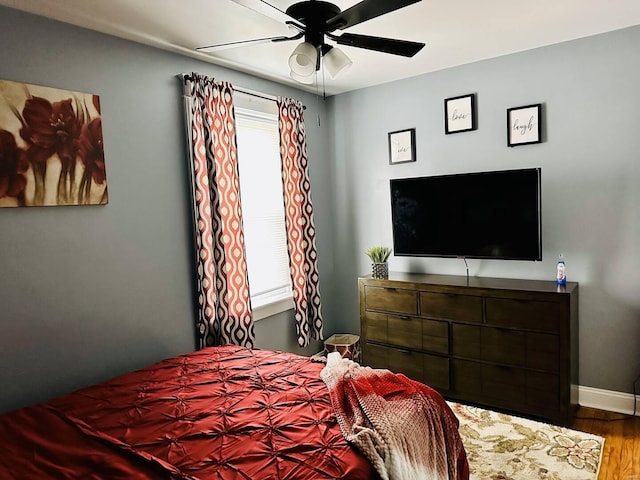 bedroom featuring hardwood / wood-style floors and ceiling fan