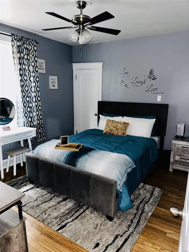 bedroom featuring ceiling fan and hardwood / wood-style floors