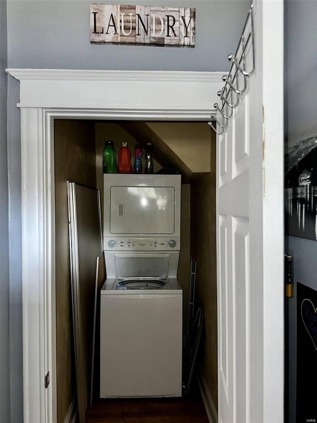 washroom with stacked washer and clothes dryer