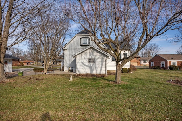 view of home's exterior featuring a lawn