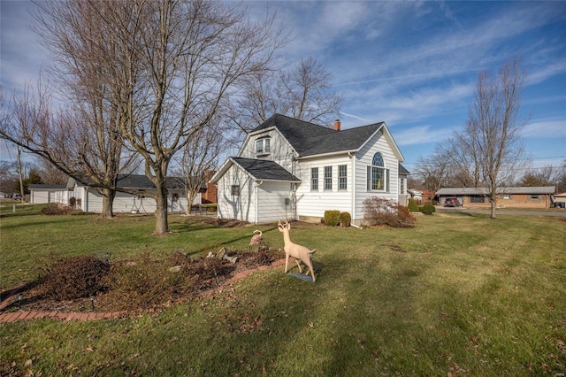 view of property exterior featuring a lawn